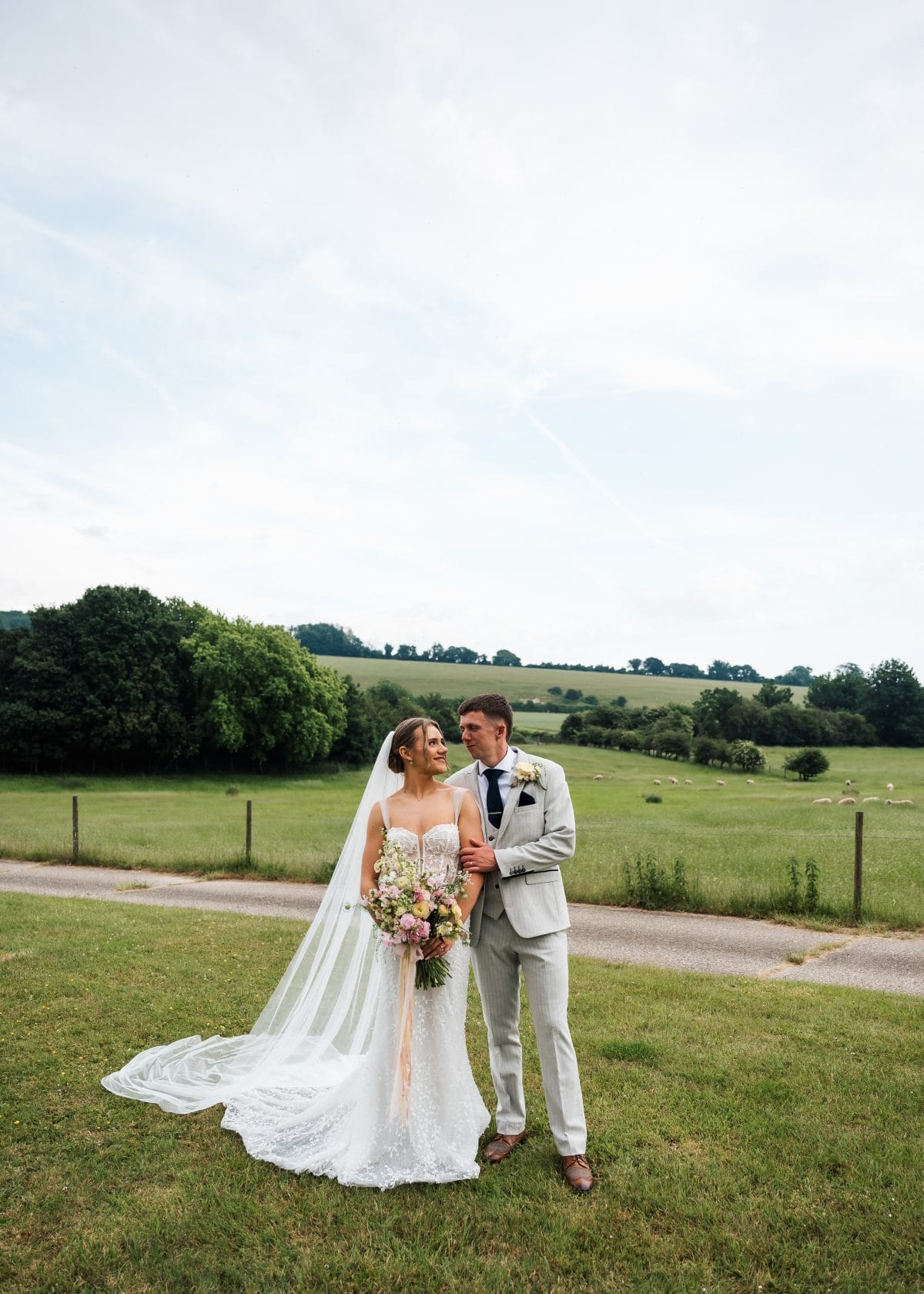 Bride and Groom in a field