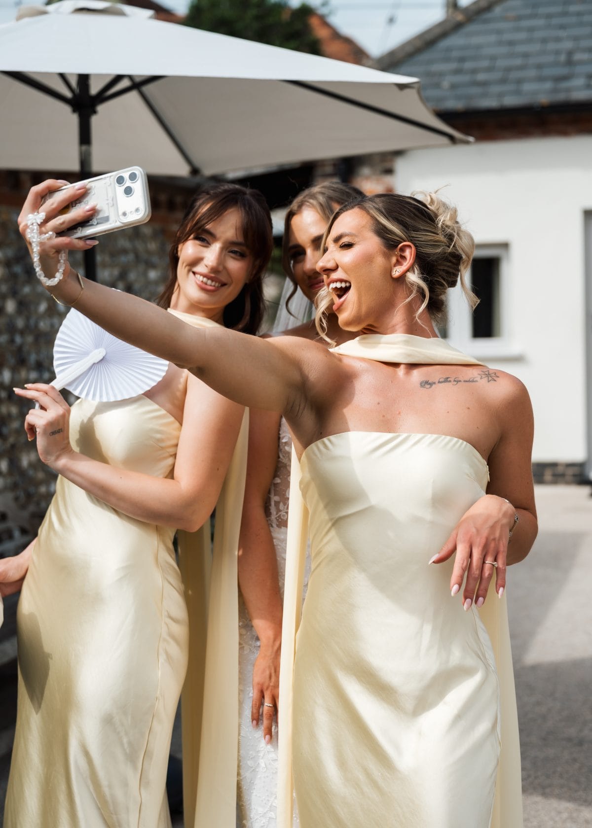 Bridesmaids in butter yellow taking a selfie